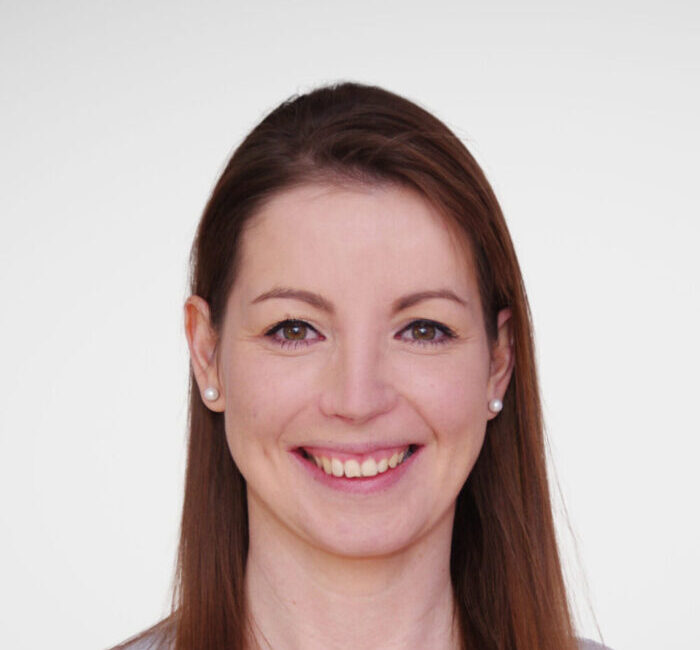 a woman smiling at the camera